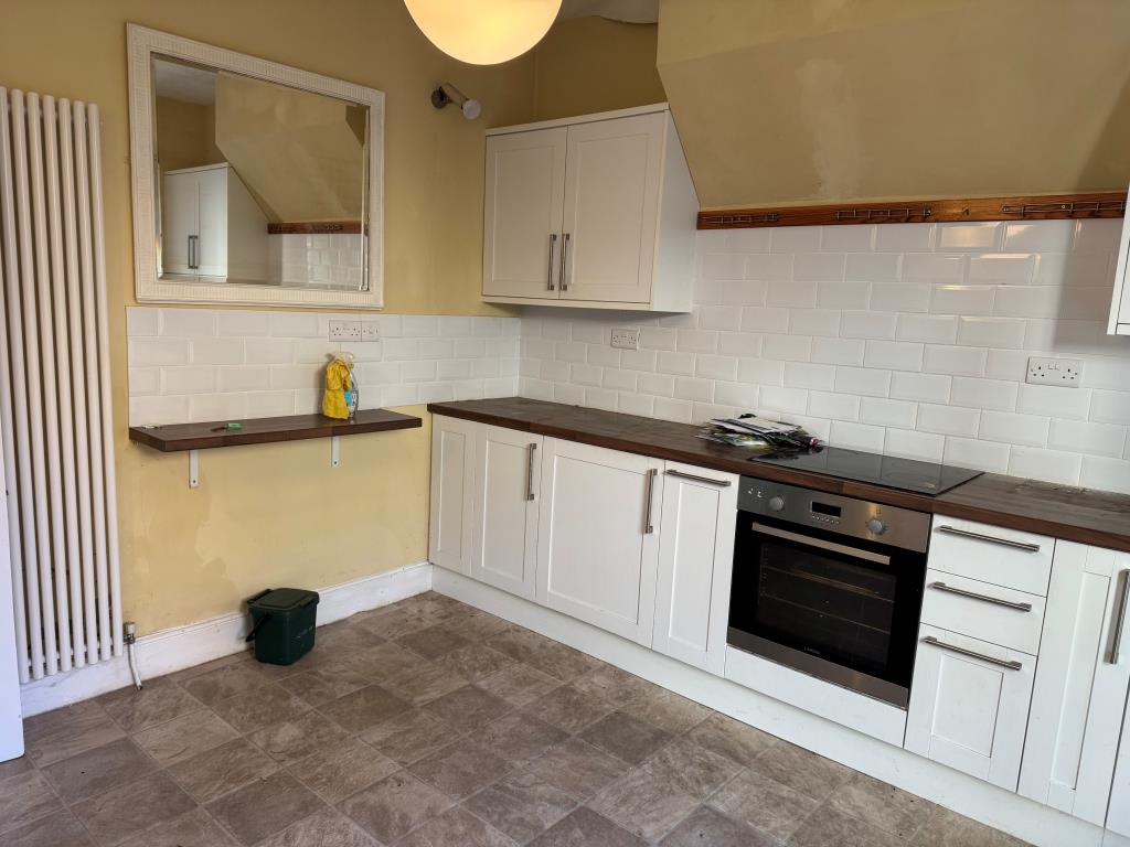 Lot: 141 - FOUR-BEDROOM HOUSE FOR IMPROVEMENT WITH SEA VIEWS - Looking Back Into the Kitchen